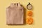 Knolling flat lay with cozy sweater and cup coffe and pumpkins on yellow background