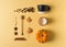 Knolling flat lay with ingredient pumpkin latte coffee, spices and glass on yellow background