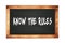 KNOW  THE  RULES text written on wooden frame school blackboard