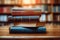 Knowledge hub Stacks of books, wooden table, blurred bookshelf environment