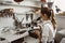 She knows what she is doing. Portrait of female jeweler looking at the new jewelery product through microscope in a