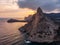 Koba-kaya mountain in sea in Crimea, large rock at beautiful sunset and seascape nature landscape, aerial panoramic view from