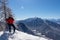 Kobesnock - Woman with scenic view of snow capped mountain peak Dobratsch, Julian Alps and the Karawanks, Austria