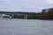 Koblenz, Germany - 02 20 2021: Autobahn A48 bridge across the Rhine with an island and the refinery in background