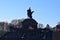 Koblenz, Germany - 02 27 2022: Kaiser Wilhelm Statue from 1897 on Deutsches Eck with waving flags of the German states