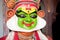 Kochi, India - 20 september 2019: close upof kathakali actor acting with sringara expression and applying make up before a