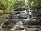 Kodaikanal, Tamil Nadu, India - June 13, 2010 Pambar falls, small waterfall with steep precipitous path