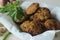 Kodo millet fritters. A crispy fritters made with cooked and mashed kodo millet flour and spices. Disk shaped deep fried evening