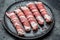 Kofta kebab or chevapchichi. sausages minced meat wrapped in bacon. Food recipe background. Close up