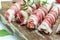 Kofta kebab or chevapchichi. sausages minced meat wrapped in bacon. Food recipe background. Close up