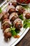 Kofta skewers, meatballs and red onion with addition of fresh mint and thyme