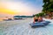 Koh Lipe, Thailand - 13.11.2019: Tourist are sitting on big pillows at Ko Lipe restaurant. Beach relaxation on pillows with summer