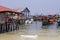 Koh Rong island, Cambodia - April 7, 2018: Seaside view with rustic house on piles and wood boats