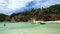 KOH TAO, THAILAND - JULY 15, 2019: Tourists Kayaking in Bay Water