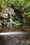 Koi fish in pond at the garden with a waterfall