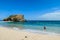 Koka Beach - A man running along the waves