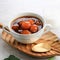 Kolak Biji Salak or Sweet Potato Porridge in White Bowl in White Background, Made from Sweet Potato, Sago Flour, Brown Sugar and