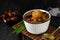 Kolak Pisang Kurma or Banana Dates Fruit Compote Made from Sliced Banana and Dates Fruit Stew in Coconut Milk and Brown Sugar