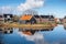 KOLHORN, NORTH HOLLAND, THE NETHERLANDS - JANUARY 24,2021: Scenic dutch countryside landscape reflected in water