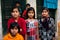 KOLKATA, INDIA: Unidentified children pose on the street after school classes