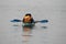 Kolkata, West Bengal/India - December 2, 2018:   Water background with Two random people with life jacket rowing boat on a evening