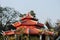 Kolkata, West Bengal/India - February 3, 2018: Red White colored Buddhist Temple shaped structure with sky and nature around
