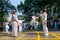 KOLKATA, WEST BENGAL, INDIA - MARCH 21ST 2015 : Young boy in white dress jumping off ground to kick, karate practice at