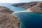 Kolona Fykiada double sided sandy beach, aerial drone view. Greece, Kithnos island, Cyclades