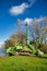 Komatsu amphibious dozer on a river bank in autumn day.