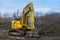 Komatsu excavator at road construction site.