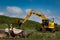 Komatsu excavator shovelling soil into a dumper