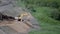 Komatsu PC200 excavator working on the side of the road.