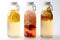 Kombucha in bottles on white. Set of glass bottles with filtered kombucha drinks made of yeast, sugar and tea with addition of