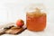 Kombucha tea with scoby brewing with apple and cinnamon on cutting board