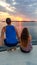 Komodo - A couple enjoying sunset from the boat