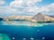 Komodo - A drone shot of a paradise island with some boats anchored around