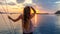 Komodo - A girl enjoying sunset from the boat