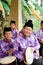 Kompang boys with songkok on, smiling.