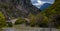 Konitsa city arced bridge and voidomatis river in autumn , greece