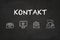 `Kontakt` text and icons on a blackboard. Translation: `Contact`