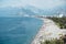 Konyaalti beach in Antalya, Turkey. Long Turkish beach on the Mediterranean sea in warm sunny summer weather. Rest of