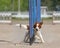 Kooikerhondje running over an agility hurdle in an agility competition