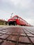 Koper, Slovenia. Red tourist bus on the Slovenian coast, related to the wine fountain. Holiday concept