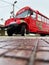 Koper, Slovenia. Red tourist bus on the Slovenian coast, related to the wine fountain. Holiday concept