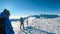 Kor Alps - Couple in snowshoes on the way to majestic summit peak Grosser Speikogel in Kor Alps, Lavanttal Alps