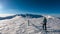 Kor Alps - Woman in snowshoes on the way to majestic summit peak Grosser Speikogel in Kor Alps, Lavanttal Alps