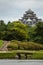 Koraku-en garden with black medieval castle in Okayama
