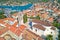 Korcula island. Town of Vela Luka church tower and rooftops aerial view