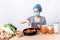 Korean attractive woman wearing surgical mask, is making Kimchi