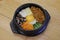 Korean Bibimbap dish with rice and vegetables on wood background